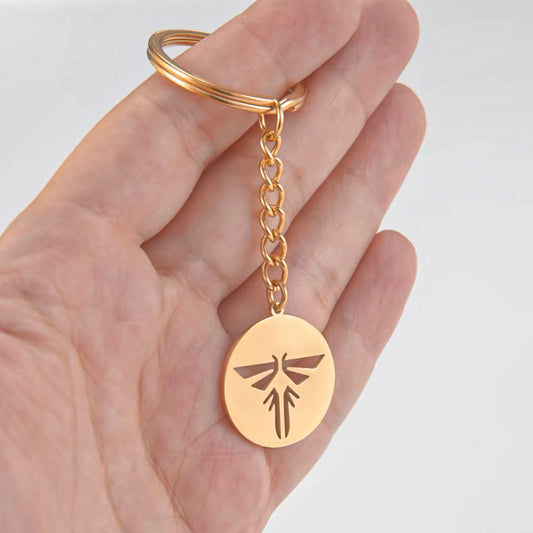 The Last of Us Retro Hollowed Firefly Logo Keychain Gold/Silver