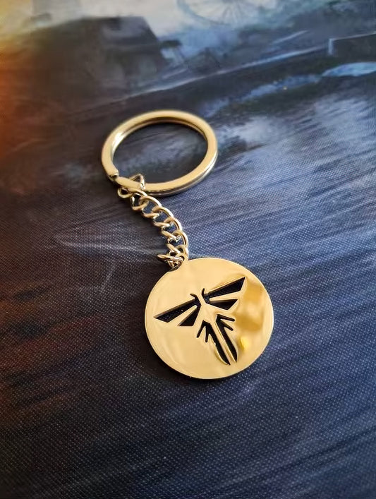 The Last of Us Retro Hollowed Firefly Logo Keychain Gold/Silver