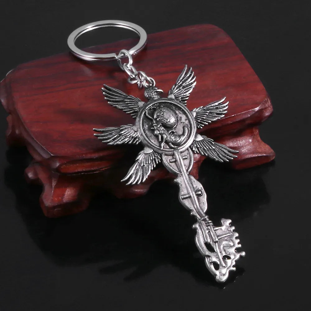 Resident Evil 8 RE8 Village Six-Winged Unborn Silver Key Keychain - Available at 2Fast2See.co