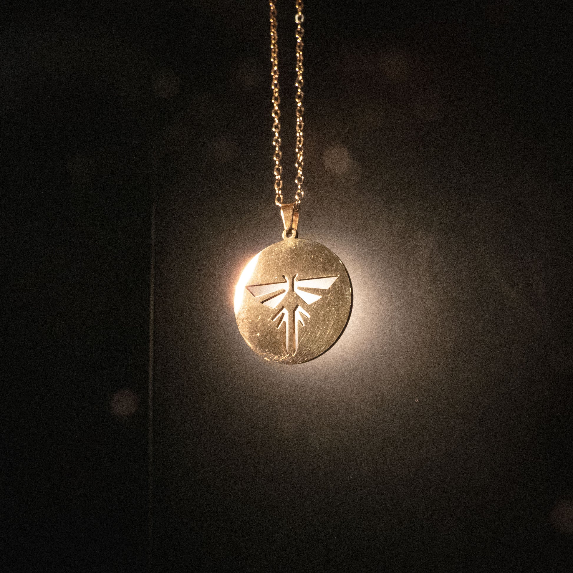 The Last of Us Premium Gold Firefly Necklace - Gold Available at 2Fast2See.co