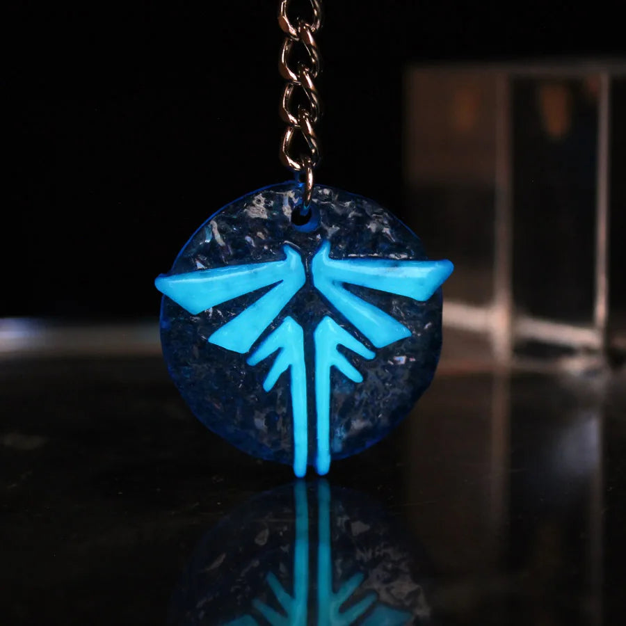 The Last Of Us Glowing Firefly Keychain - Available at 2Fast2See.co