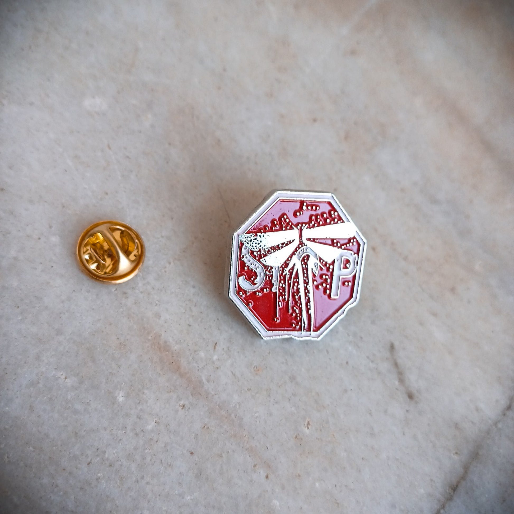 The Last of Us Metal Firefly Stop Sign Pin - Available at 2Fast2See.co