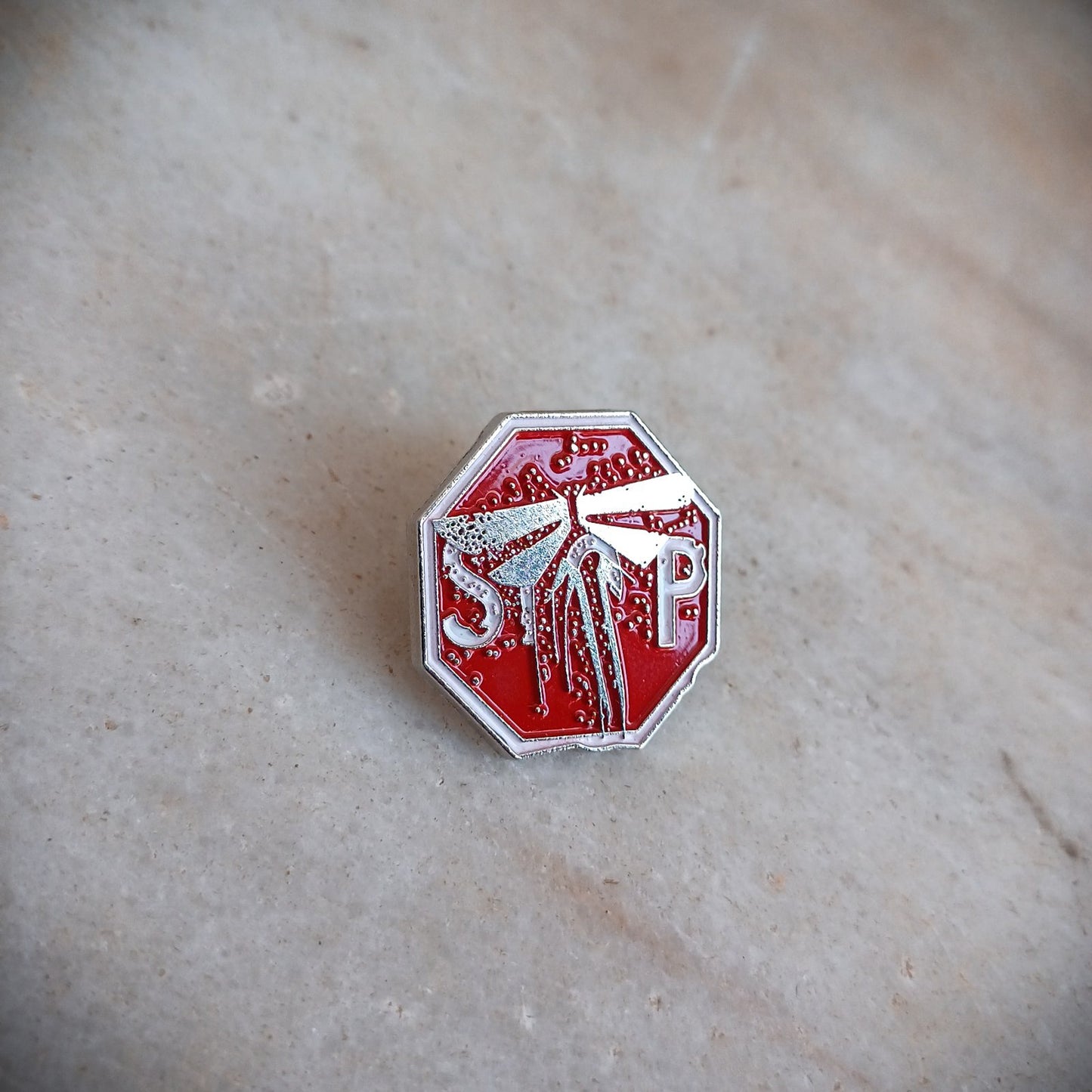 The Last of Us Metal Firefly Stop Sign Pin - Available at 2Fast2See.co